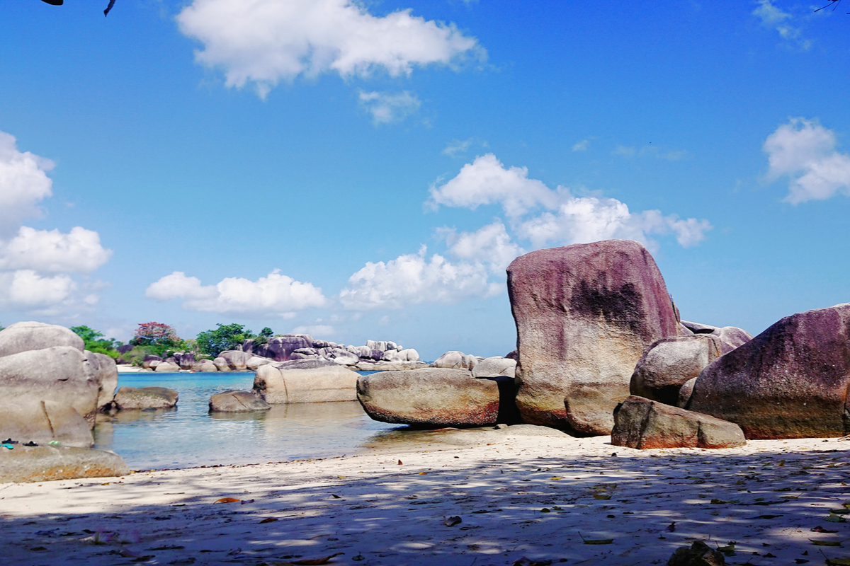 a bright sunny Tanjung Tinggi Beach with rocks